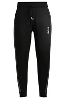 Tracksuit bottoms with foil-print logo