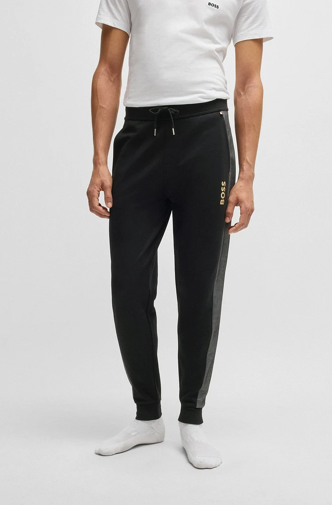 Tracksuit bottoms with foil-print logo