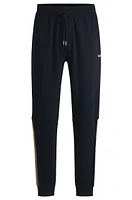 Cotton-terry tracksuit bottoms with tape inserts