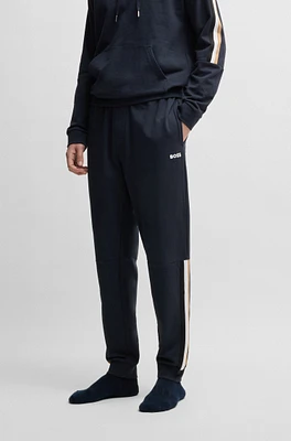 Cotton-terry tracksuit bottoms with tape inserts