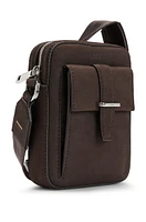 Leather reporter bag with branded trims