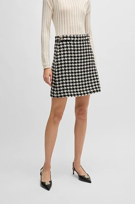 Houndstooth mini skirt with metallic buttons