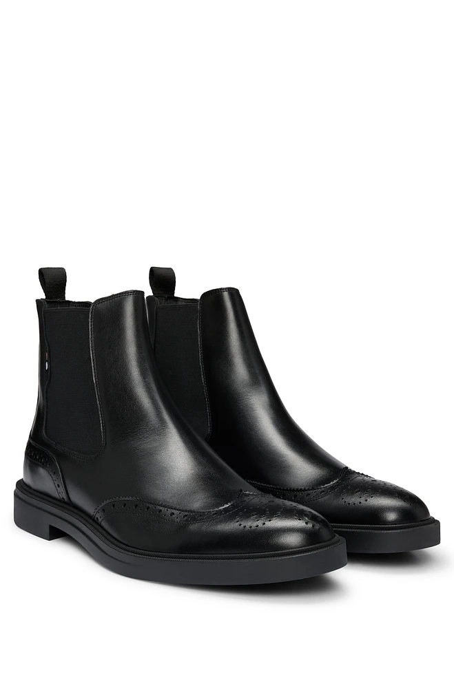 Leather Chelsea boots with brogue details and rubber sole