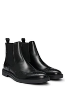 Leather Chelsea boots with brogue details and rubber sole