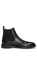 Leather Chelsea boots with brogue details and rubber sole