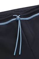 Tracksuit bottoms with tape and logo