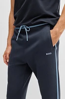 Tracksuit bottoms with tape and logo