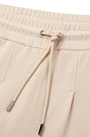 Wide-leg tracksuit bottoms with pleat details