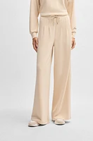 Wide-leg tracksuit bottoms with pleat details