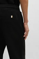 BOSS - Mercerized-cotton tracksuit bottoms with stripe waistband Black