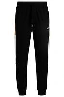 Cotton-terry tracksuit bottoms with contrast side panels