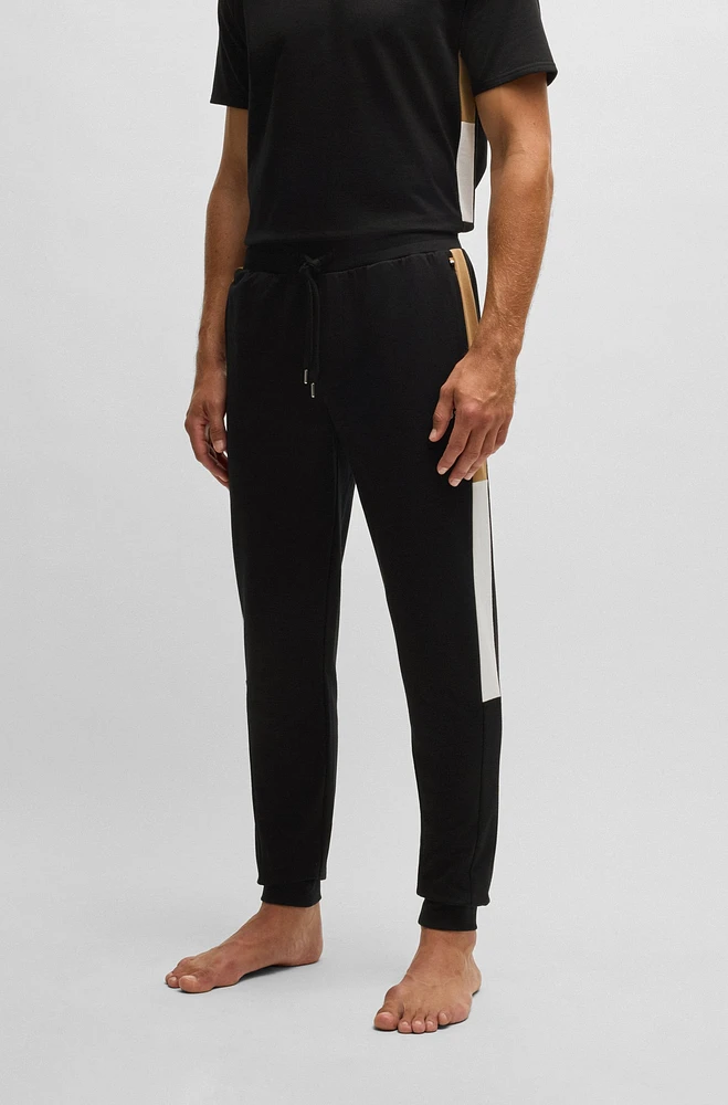 Cotton-terry tracksuit bottoms with contrast side panels