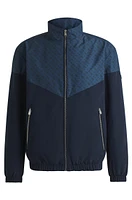 Water-repellent jacket with monogram pattern