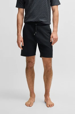 shorts with monogram-pattern panels