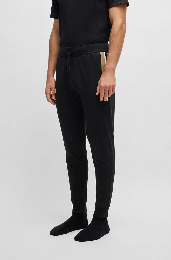 Cotton-terry tracksuit bottoms with stripe print