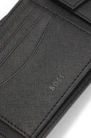Structured trifold wallet with monogram pattern