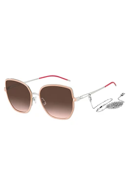 Nude-frame sunglasses with forked temples and branded chain