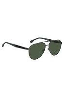 Double-bridge sunglasses with green-shaded lenses