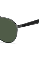 Double-bridge sunglasses with green-shaded lenses