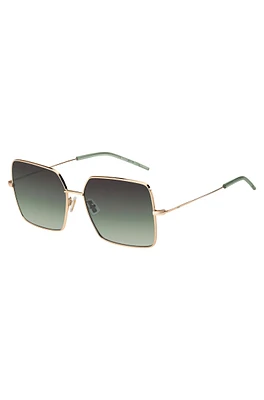 Gold-tone sunglasses with green end-tips