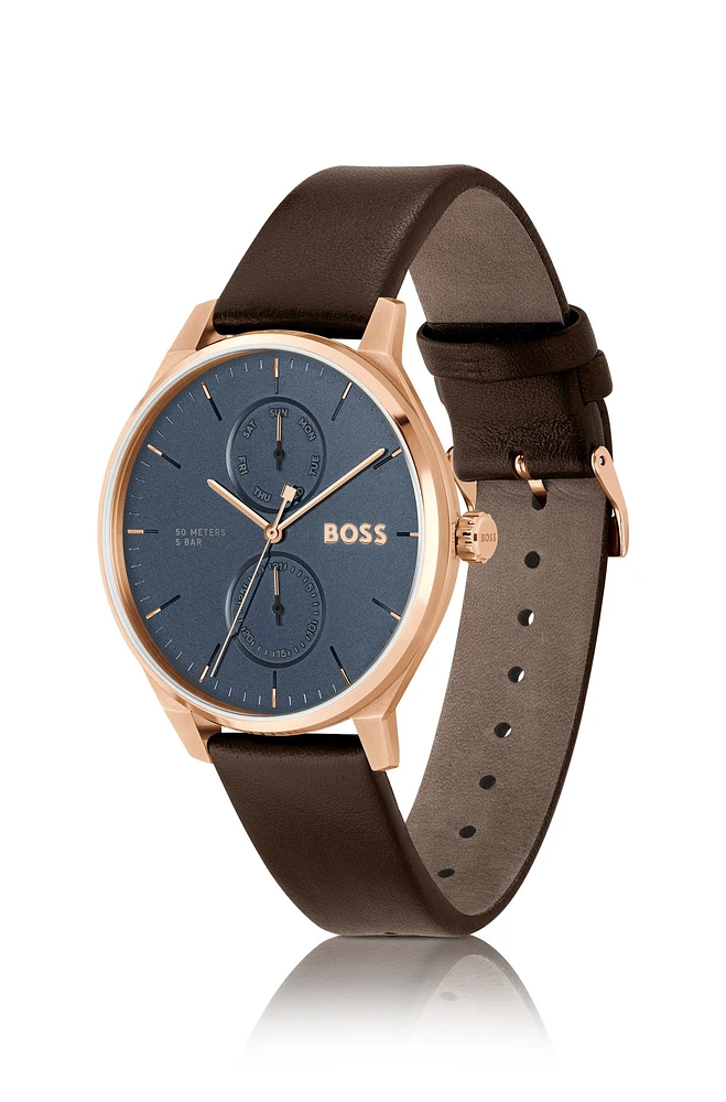 Gold-tone watch with blue dial and leather strap