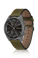 Black-dial chronograph watch with green leather strap