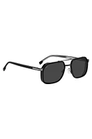 Double-bridge sunglasses in layered black acetate