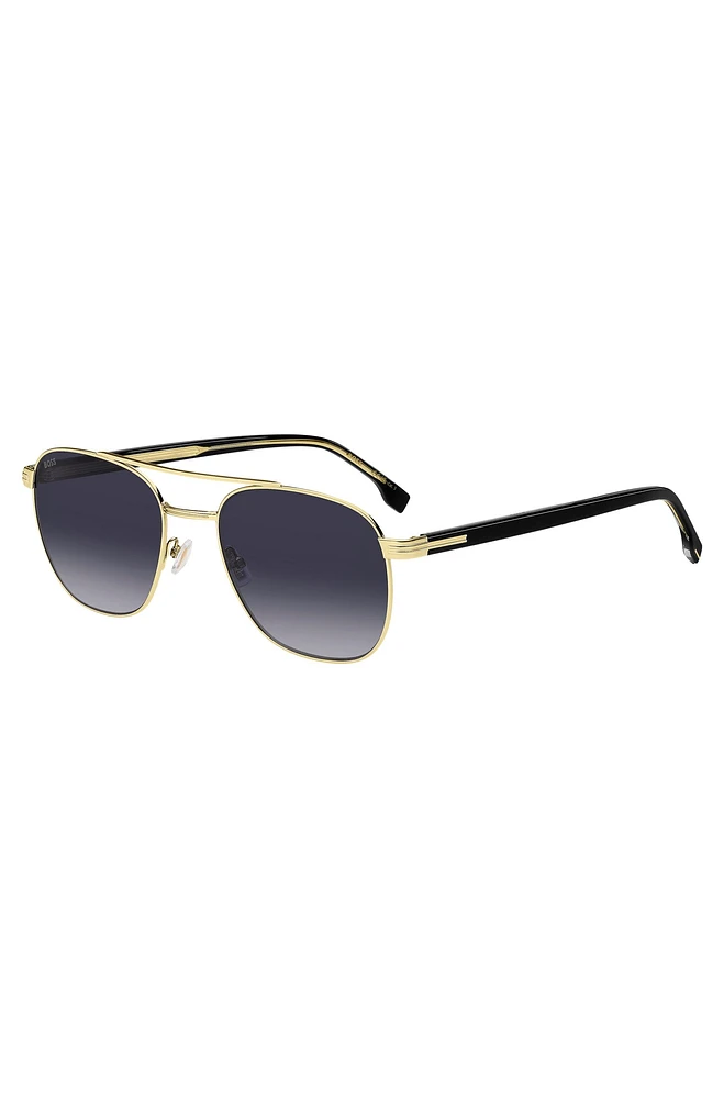 Double-bridge sunglasses in black and gold tones