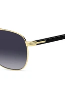 Double-bridge sunglasses in black and gold tones