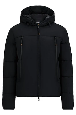 Equestrian hooded puffer jacket with fleece-lined pockets