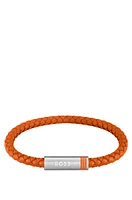 Orange braided-leather cuff with magnetic logo closure