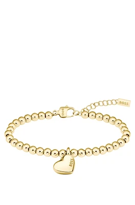 Gold-tone beaded bracelet with logo heart charm