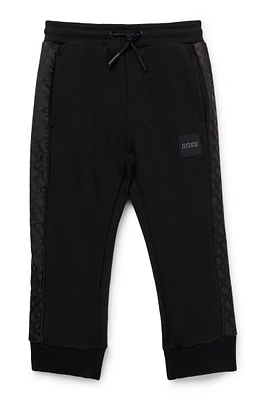 Kids' tracksuit bottoms with monogram inserts