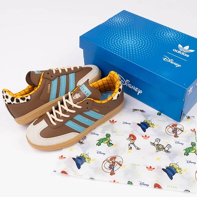 Adidas Disney Pixar Toy Story Samba OG Woody Athletic Shoe - Little Kid Preloved Brown / Blue Alumina at Hamilton Place in Chattanooga, TN Adidas Disney Pixar Toy Story Samba OG Woody Athletic Shoe - Little Kid Preloved Brown / Blue Alumina at Hamilton Place in Chattanooga, TN
