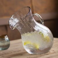 Tilted Ribbed Glass Pitcher
