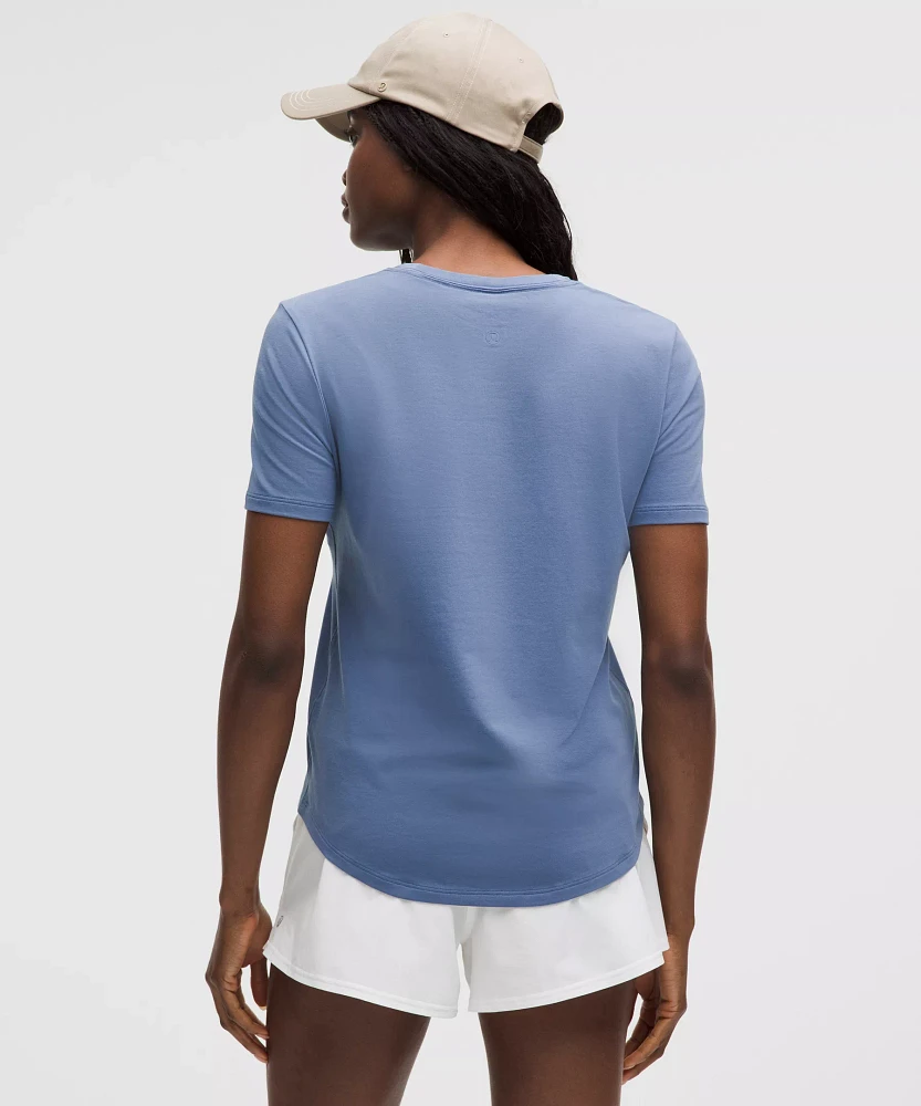 Love Curved-Hem Crewneck T-Shirt | Women's Short Sleeve Shirts & Tee's