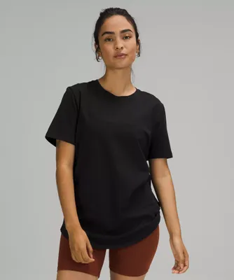 Love Curved-Hem Crewneck T-Shirt | Women's Short Sleeve Shirts & Tee's