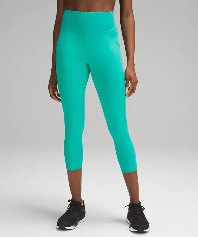 Squat, stride and stretch in the lululemon Invigorate Tight