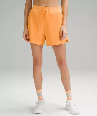 4” lululemon neon orange hotty hot shorts