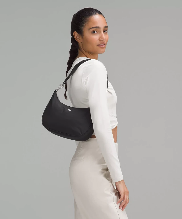 lululemon small bag Belt By Lululemon, Size: Clothes Mentor Upper Arlington OH #105 Buckle the bridge straps to draw in the top of the bag Lululemon 20th Anniversary Small Reusable
