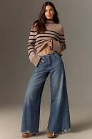 The Adi Regenerative Cotton Mid-Rise Frayed Relaxed Flare Jeans by Pilcro