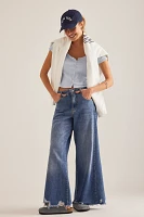 The Adi Regenerative Cotton Mid-Rise Frayed Relaxed Flare Jeans by Pilcro