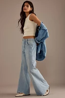 The Adi Mid-Rise Frayed Relaxed Flare Jeans by Pilcro