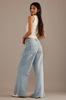 The Adi Mid-Rise Frayed Relaxed Flare Jeans by Pilcro