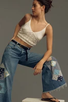 The Adi Mid-Rise Frayed Relaxed Flare Jeans by Pilcro: Patchwork Edition