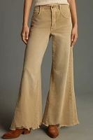 The Adi Mid-Rise Frayed Relaxed Flare Jeans by Pilcro