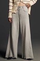 The Adi Mid-Rise Frayed Relaxed Flare Jeans by Pilcro