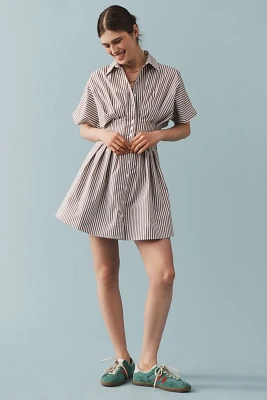 The @heynasreen Tobie Button-Front Pleated Mini Shirt Dress by Exquise