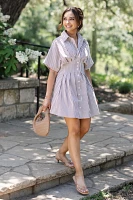 The @heynasreen Tobie Button-Front Pleated Mini Shirt Dress by Exquise