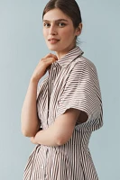 The @heynasreen Tobie Button-Front Pleated Mini Shirt Dress by Exquise